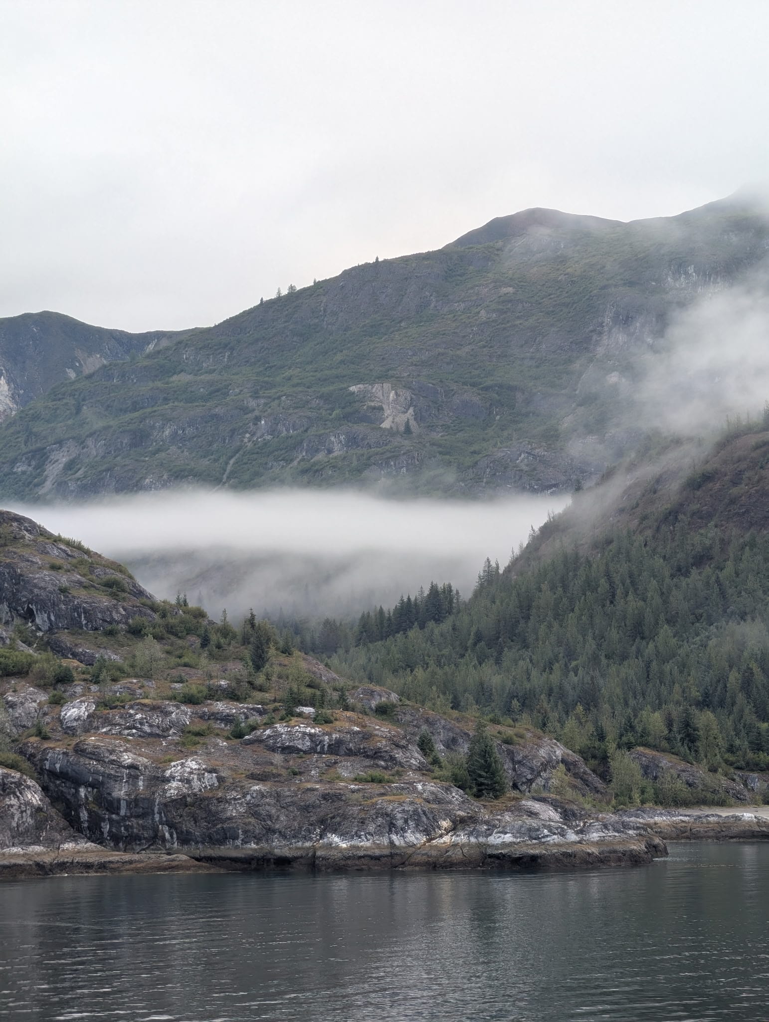 Is an Alaska Cruise a Must-Do Bucket List Trip? 2 Fog rolling over Glacier Bay National Park in Alaska